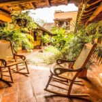 Lounge area in the hotel with wooden rocking chairs