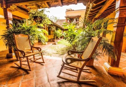 Lounge area in the hotel with wooden rocking chairs