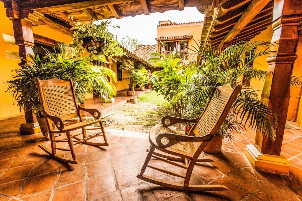 Lounge area in the hotel with wooden rocking chairs