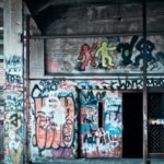 Graffiti-covered walls in a dilapidated building