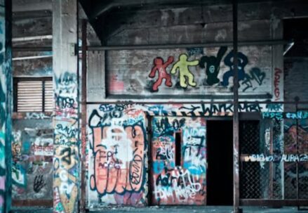 Graffiti-covered walls in a dilapidated building